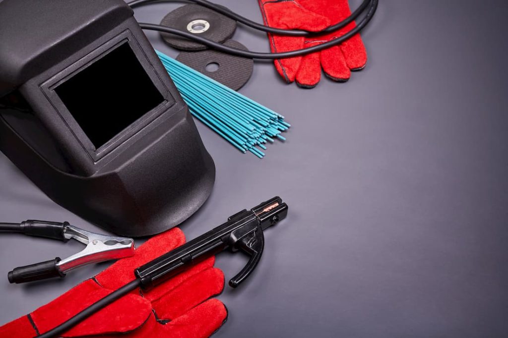 assortment of welding equipment with grey backdrop