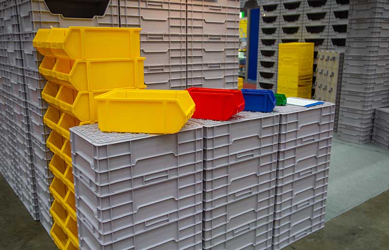 assortment of different colour plastic containers